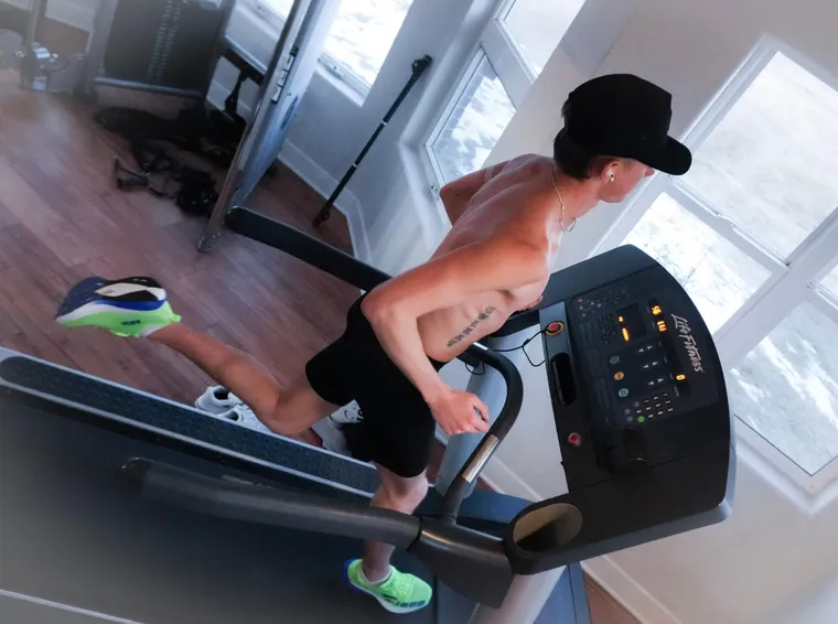 An Apex Elite athlete mid-session on an indoor treadmill